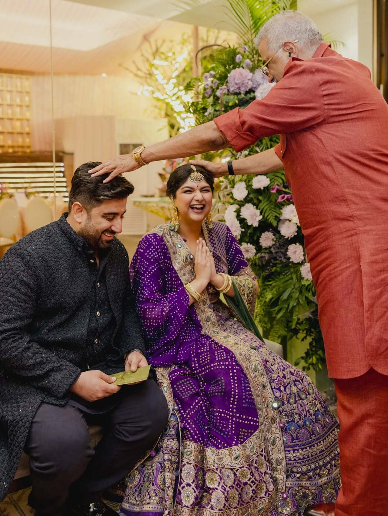 The candid moment beautifully captures father Boney Kapoor showering his love and blessings on the couple, making it one of the most heartfelt highlights of the celebration.